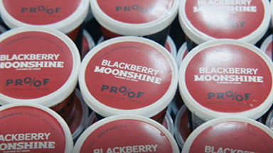 Multiple containers of Proof Blackberry Moonshine ice cream