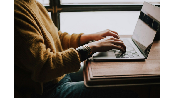 Person typing on a laptop