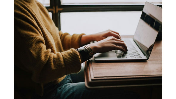 woman sitting at a laptop