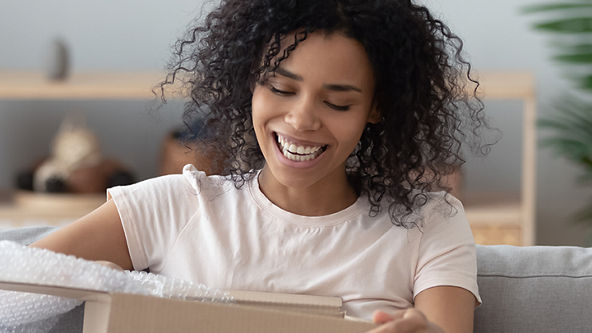 woman opening box