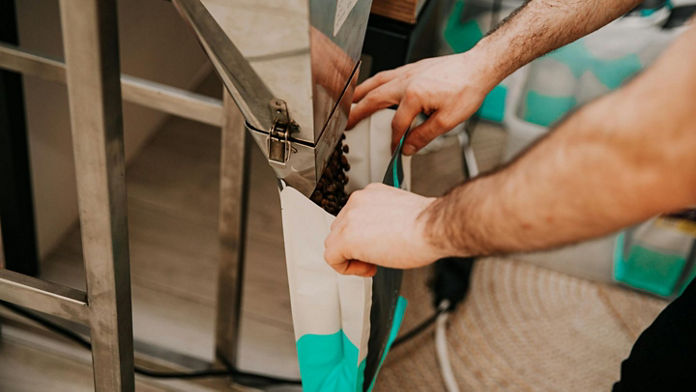 person filling up bag