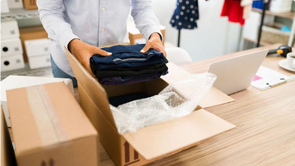 person packing box