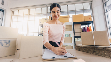 Female writing on a clipboard 