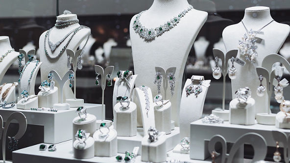 Jewelry store display with earrings, rings, and necklaces 