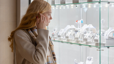 Female looking into a display case at a jewelry store