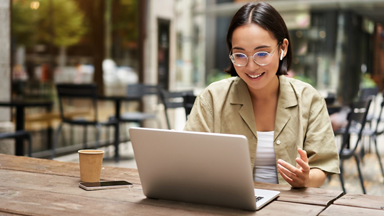 Female on a laptop outside 