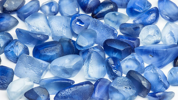 Rough blue stones on a white background 